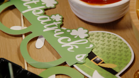 Close-Up-Of-Irish-Novelties-And-Props-With-Snacks-Of-Tortilla-Chips-And-Salsa-At-St-Patrick's-Day-Party-1